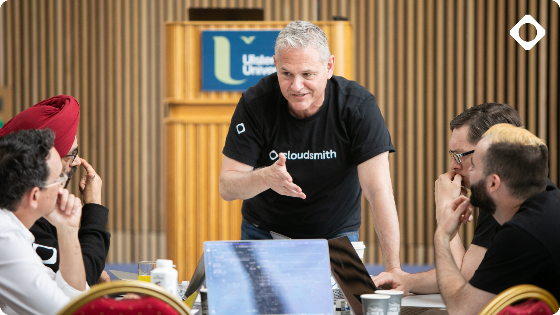 Cloudsmith CEO Glenn Weinstein chatting with team